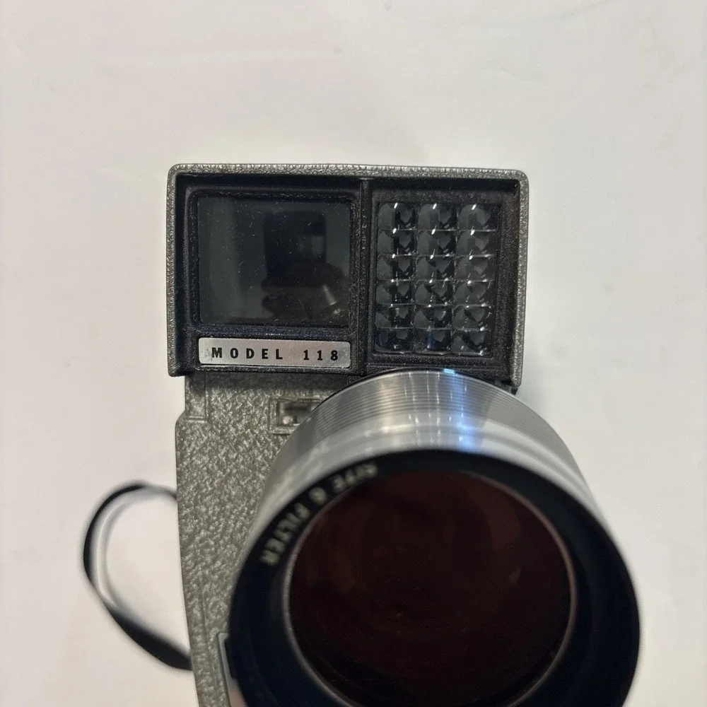 The Revere Model 118D Eye Matic 8mm Movie Camera Power Zoom Telephoto Wide Angle
